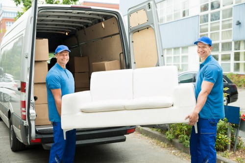 Professional packers organizing items for a London move
