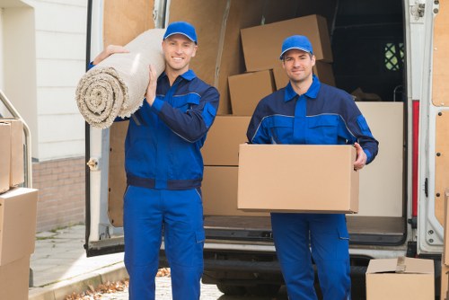 Removal team packing boxes for sustainable move in London