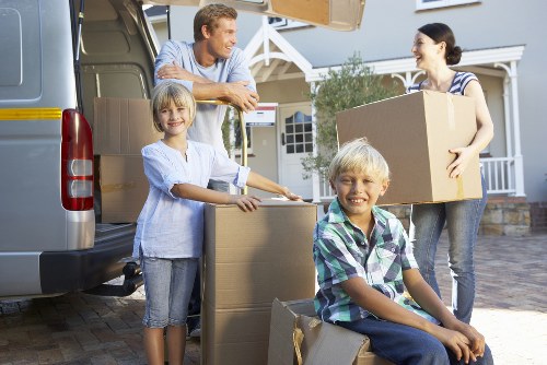Removal experts loading furniture onto a moving van